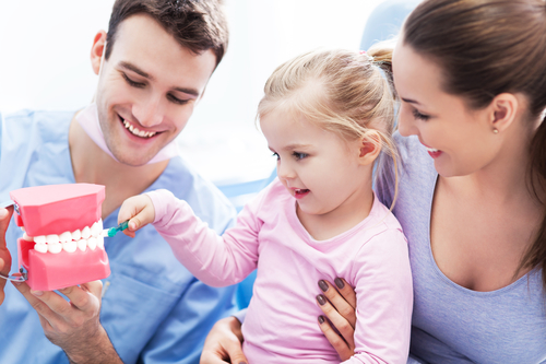 Child brushing teeth learning about childrens dental health from Dalton dentist