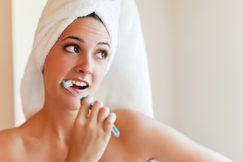 Woman brushing teeth