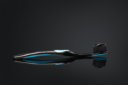 Toothbrush with black charcoal toothpaste